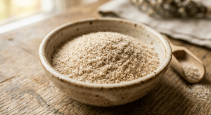 Bowl filled with light brown psyllium husk fiber powder